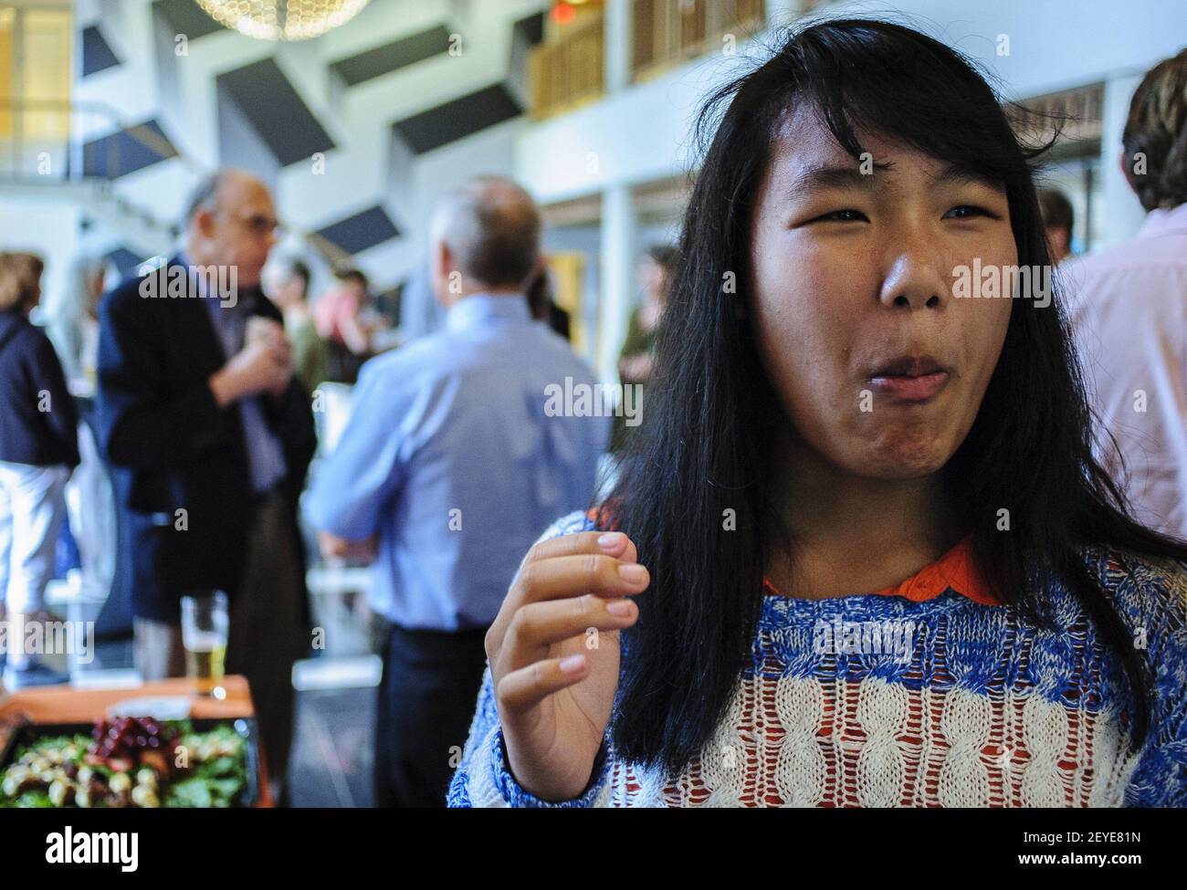 Lynne Jamart reacts after sampling a tortilla chip topped with