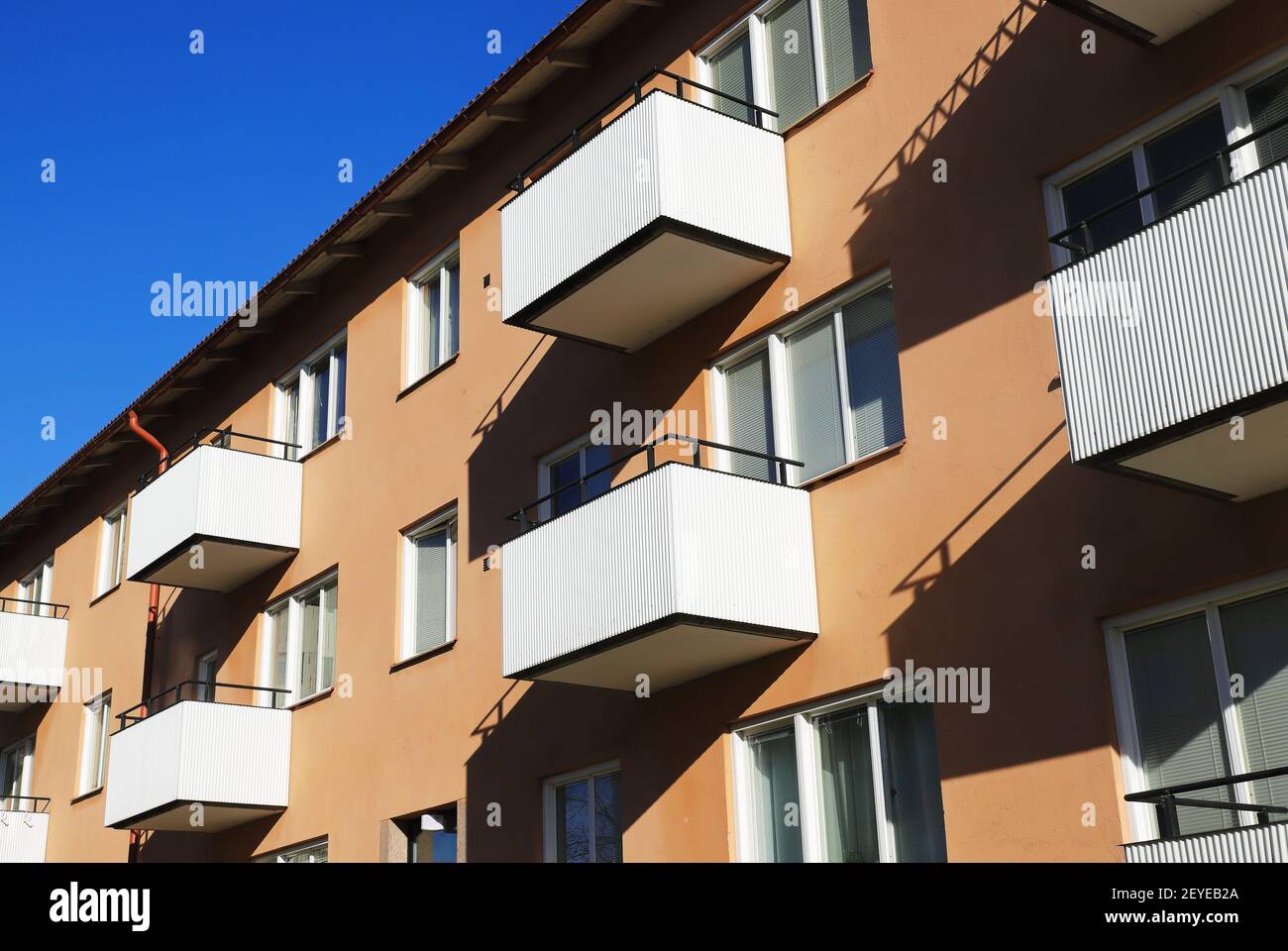 Multi-family house with apartments on three floors built in the 1940s. Stock Photo