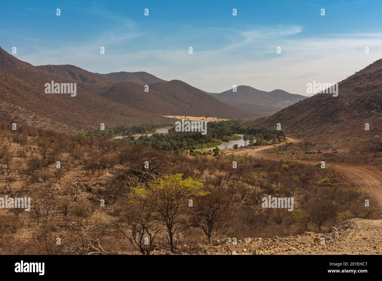 Landscape view of the Kunene River, the border river between Namibia and Angola Stock Photo