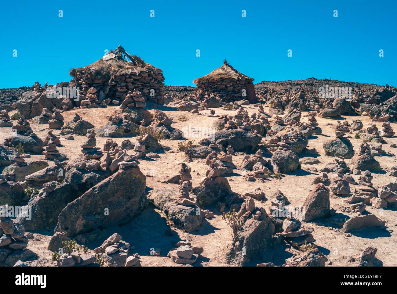 Bizarre Landscape at Abra Patapampa Pass, near the Mirador de los Volcanes Patapampa also called Mirador de los Andes with Two Old Stone Huts Stock Photo