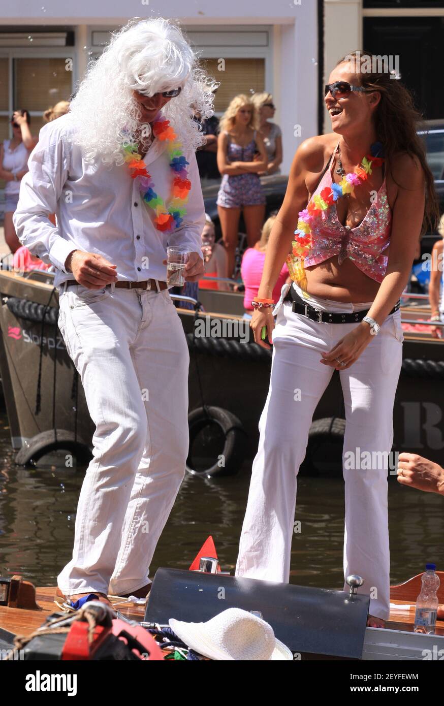 People attend the Canal Parade at Prinsengracht in Amsterdam