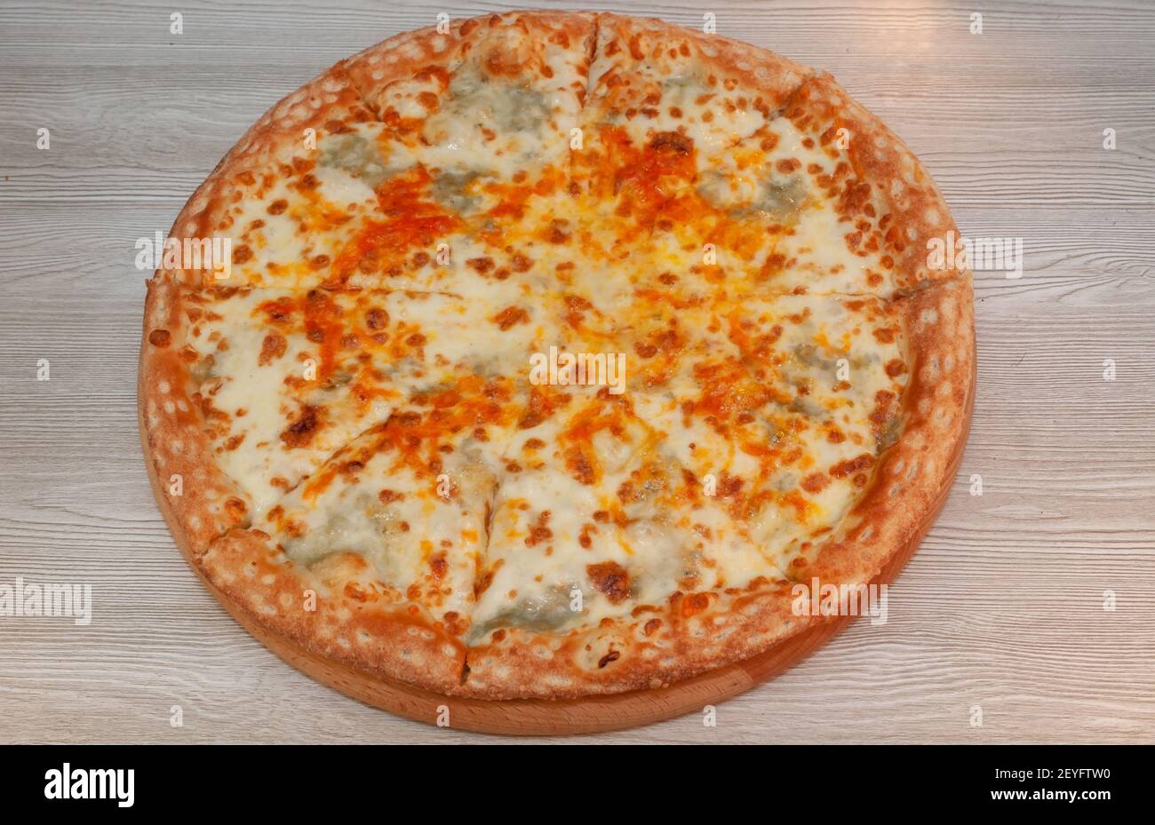 Four cheese pizza on a board. food Stock Photo