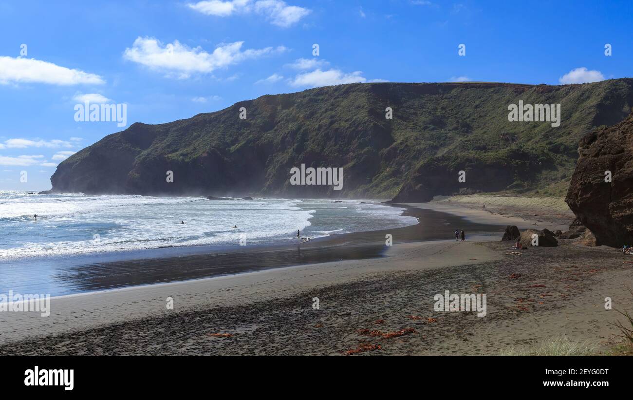 Panoramic view of O'Neill Bay, a secluded black sand beach in the scenic western Auckland Region, New Zealand Stock Photo