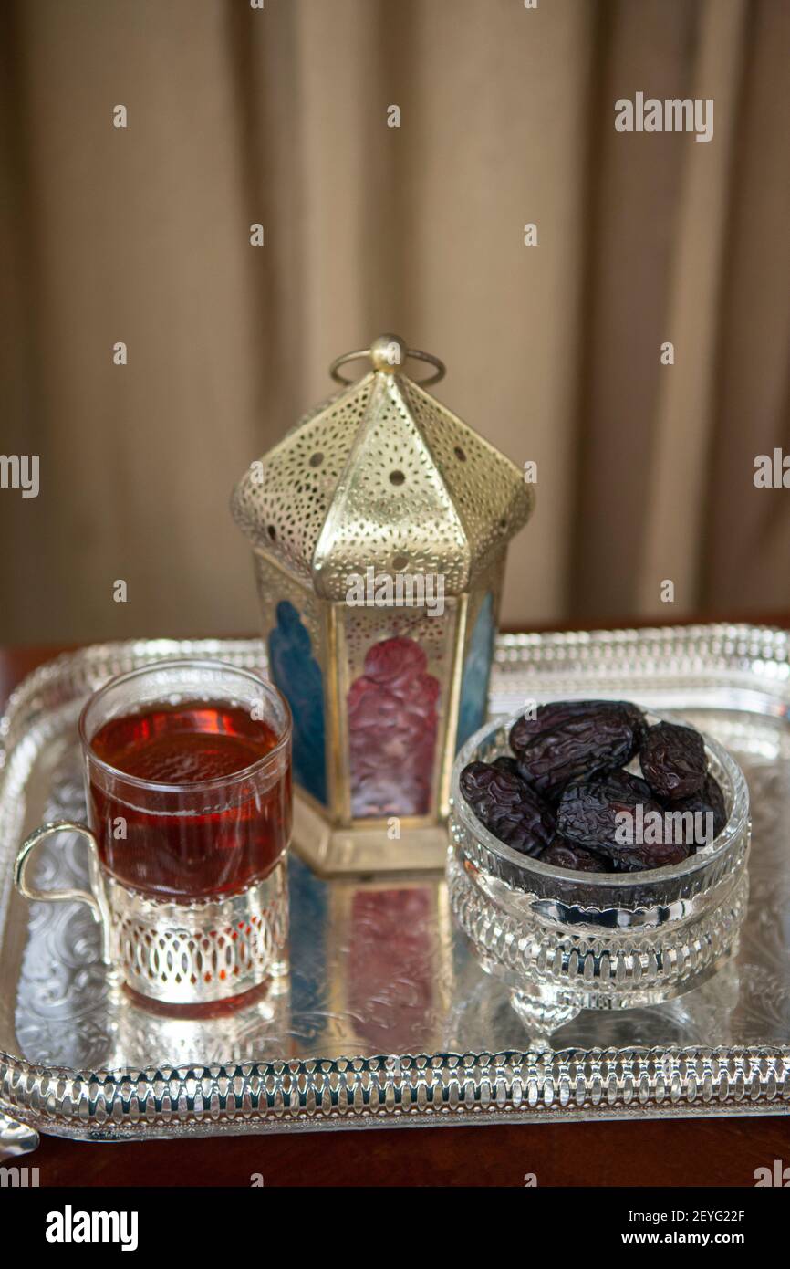 Ramadan lantern with dates and cup of tea Stock Photo