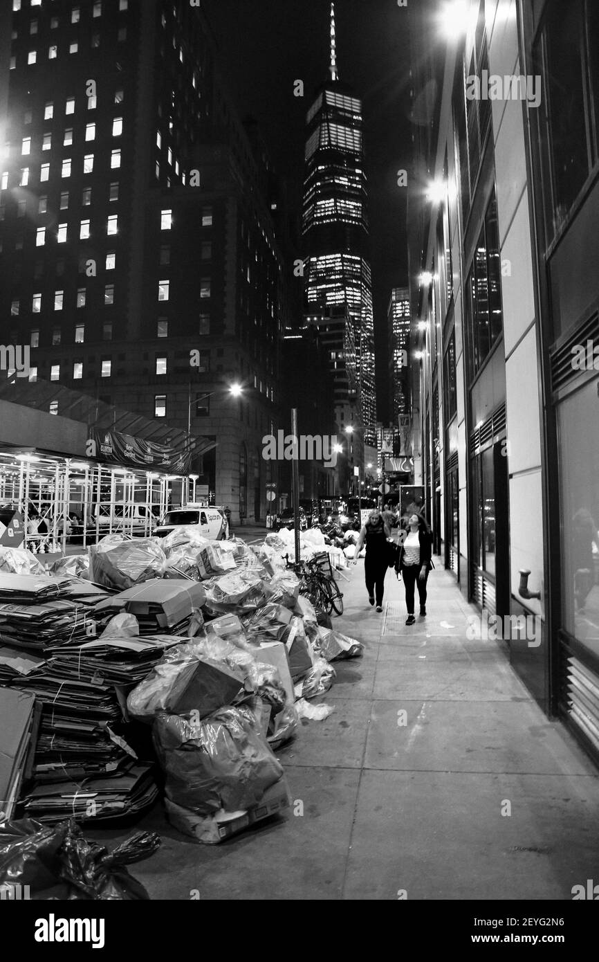 A vertical grayscale shot of NYC streets at night Stock Photo - Alamy