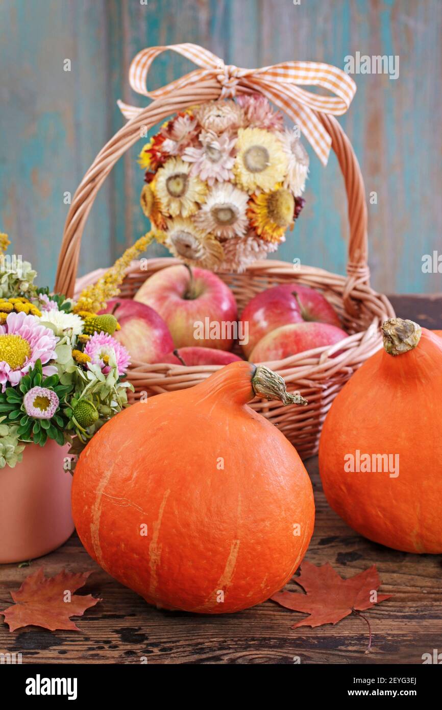 Pumpkins on rustic wooden table. Autumn decor Stock Photo