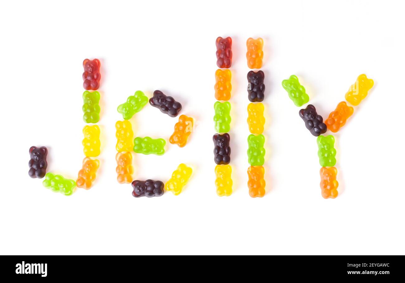 Word JELLY made of multicolored gummy bears arranged on a white background. Stock Photo