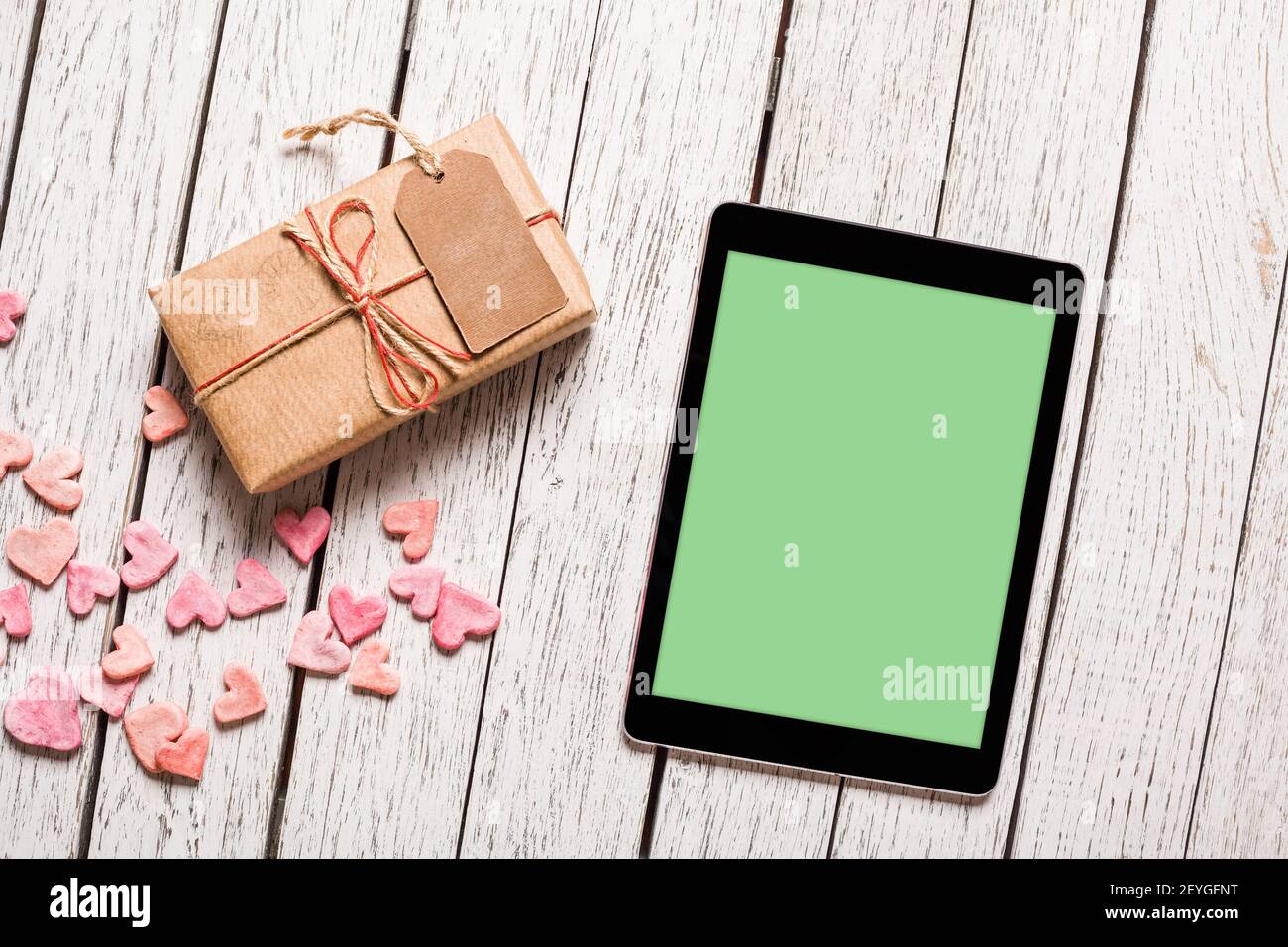Mockup of tablet pc with gift box Stock Photo