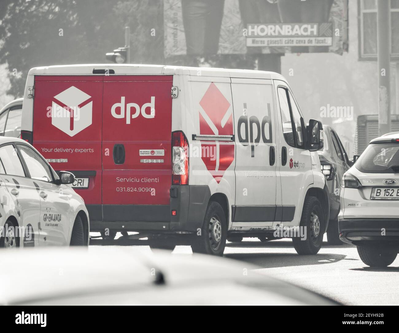 Bucharest, Romania - 02.22.2021: DPD delivery van parcel vehicle in traffic on the streets of Bucharest. Stock Photo