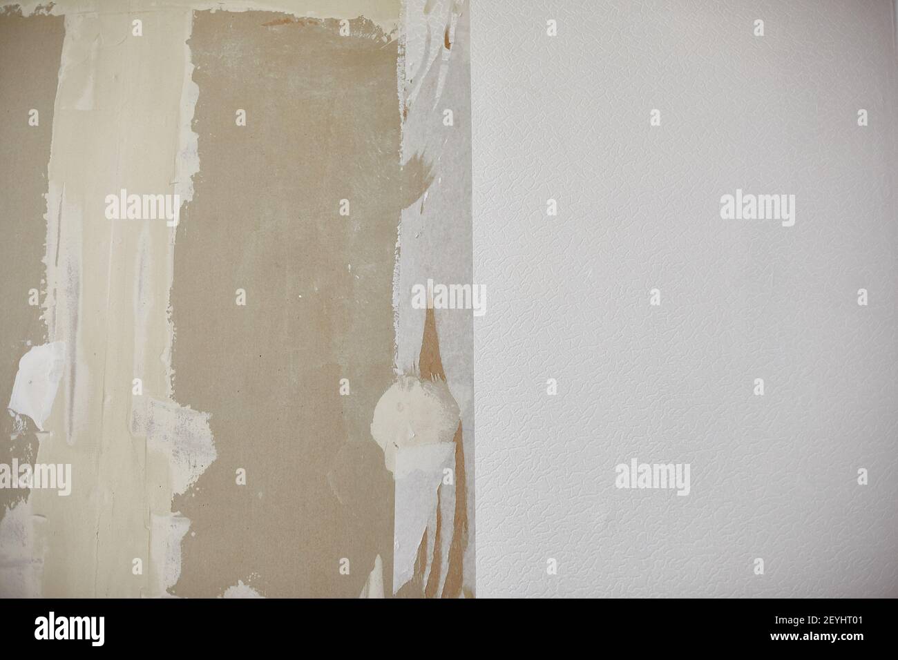 plasterboard wall, plastered with white plaster, white wallpaper on the