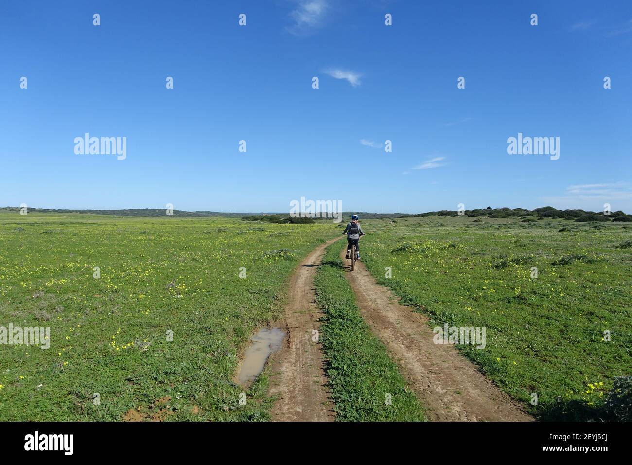 Teenager riding an electric mountain bike on a remote country track Stock Photo