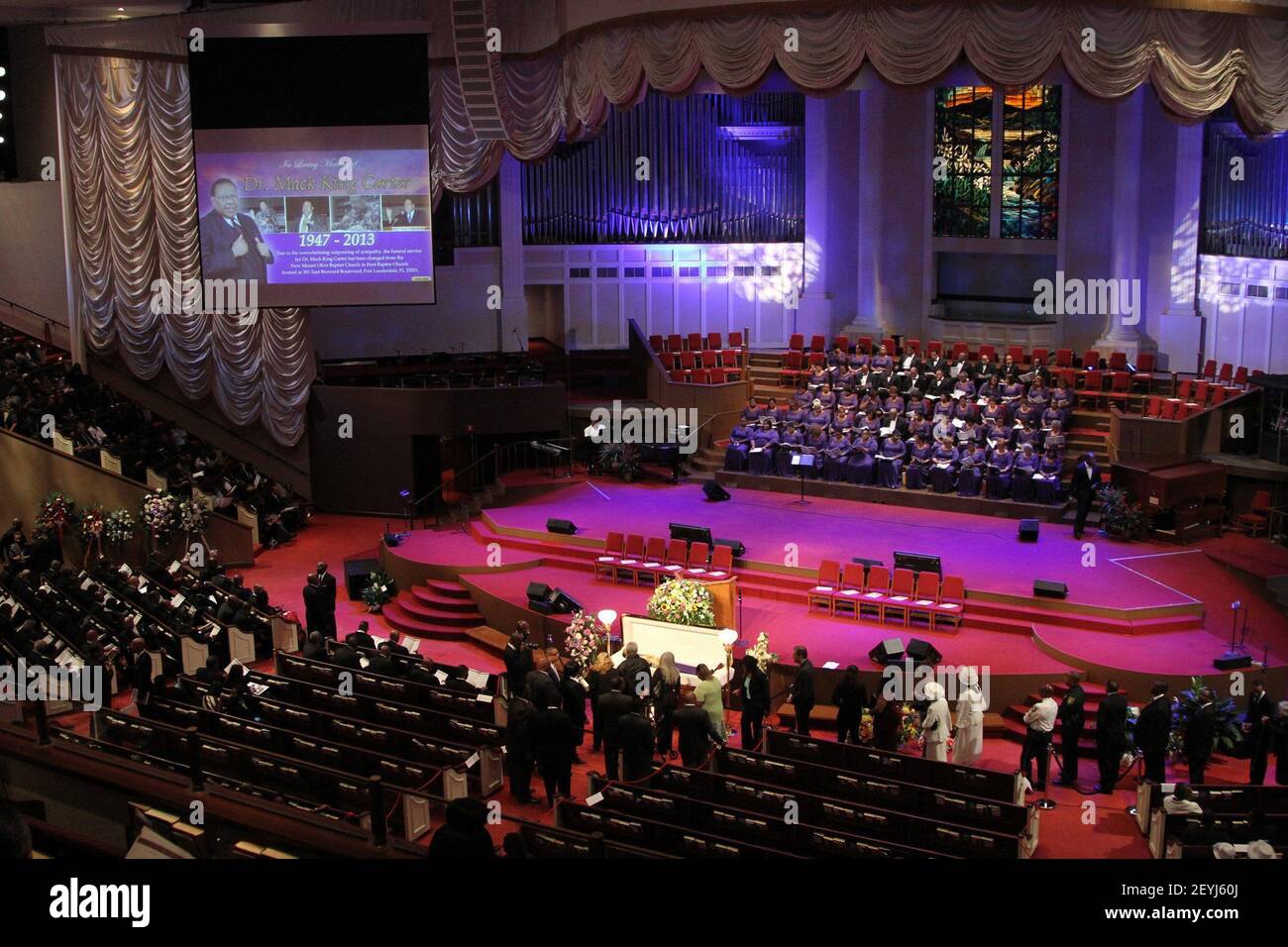Mourners gather around the casket containing the Rev. Dr. Mack King