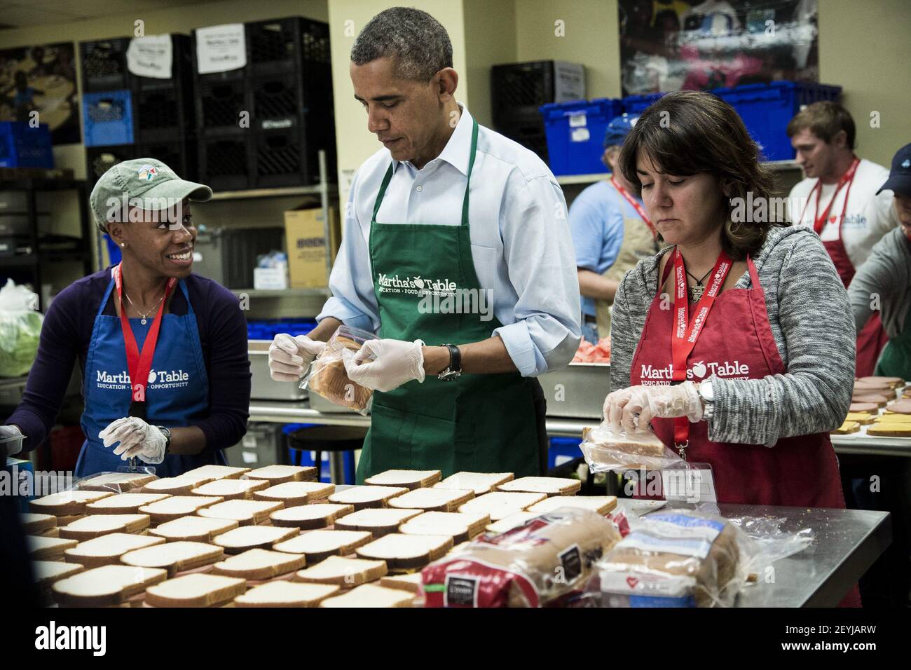 President Barack Obama helps bag sandwiches with furloughed federal  workers, including Dolly Garcia, right, who works at the U.S. Census  Bureau, and Chantelle Burton, left, who works at the Health and Human