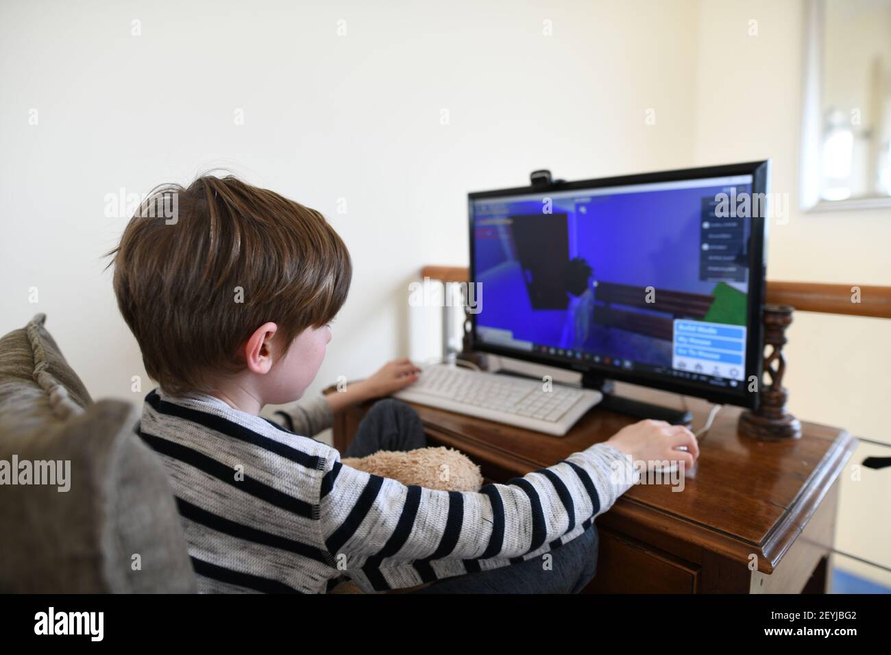 Lagos, Portugal: February 2021; Young boy playing the online game platform, Roblox on a PC at home Stock Photo