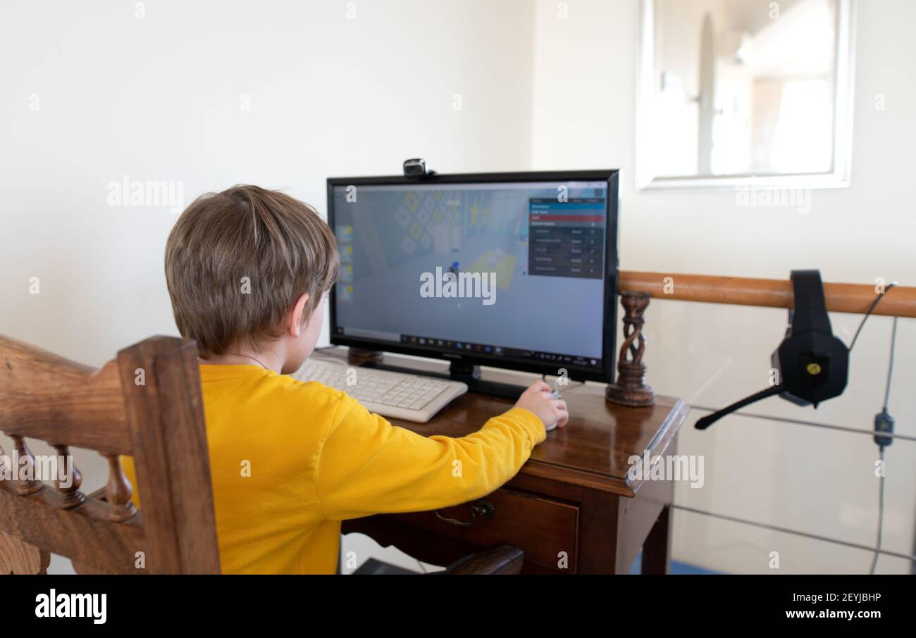 Lagos, Portugal: February 2021; Young boy playing the online game platform, Roblox on a PC at home Stock Photo
