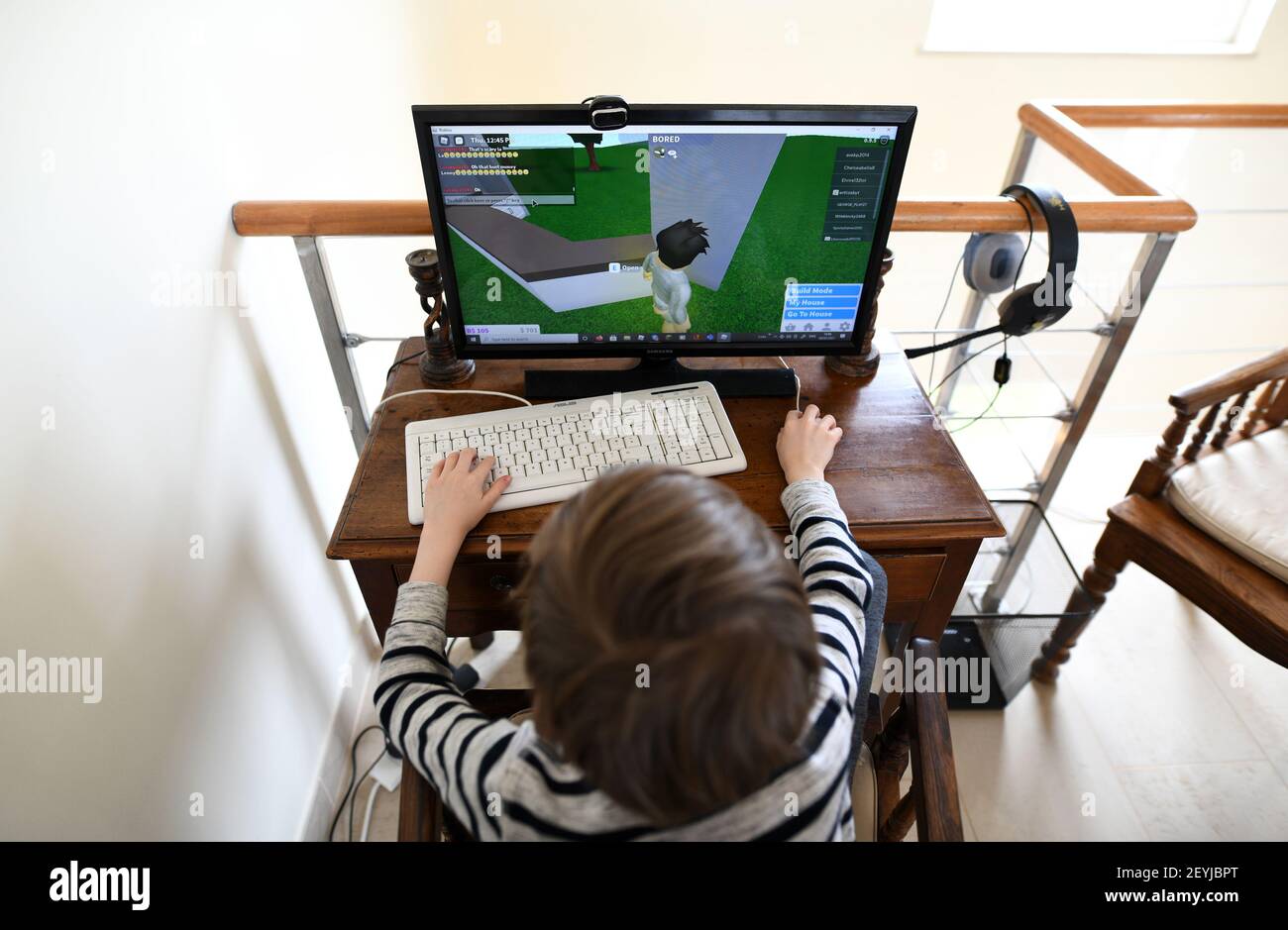 Lagos, Portugal: February 2021; Young boy playing the online game platform, Roblox on a PC at home Stock Photo