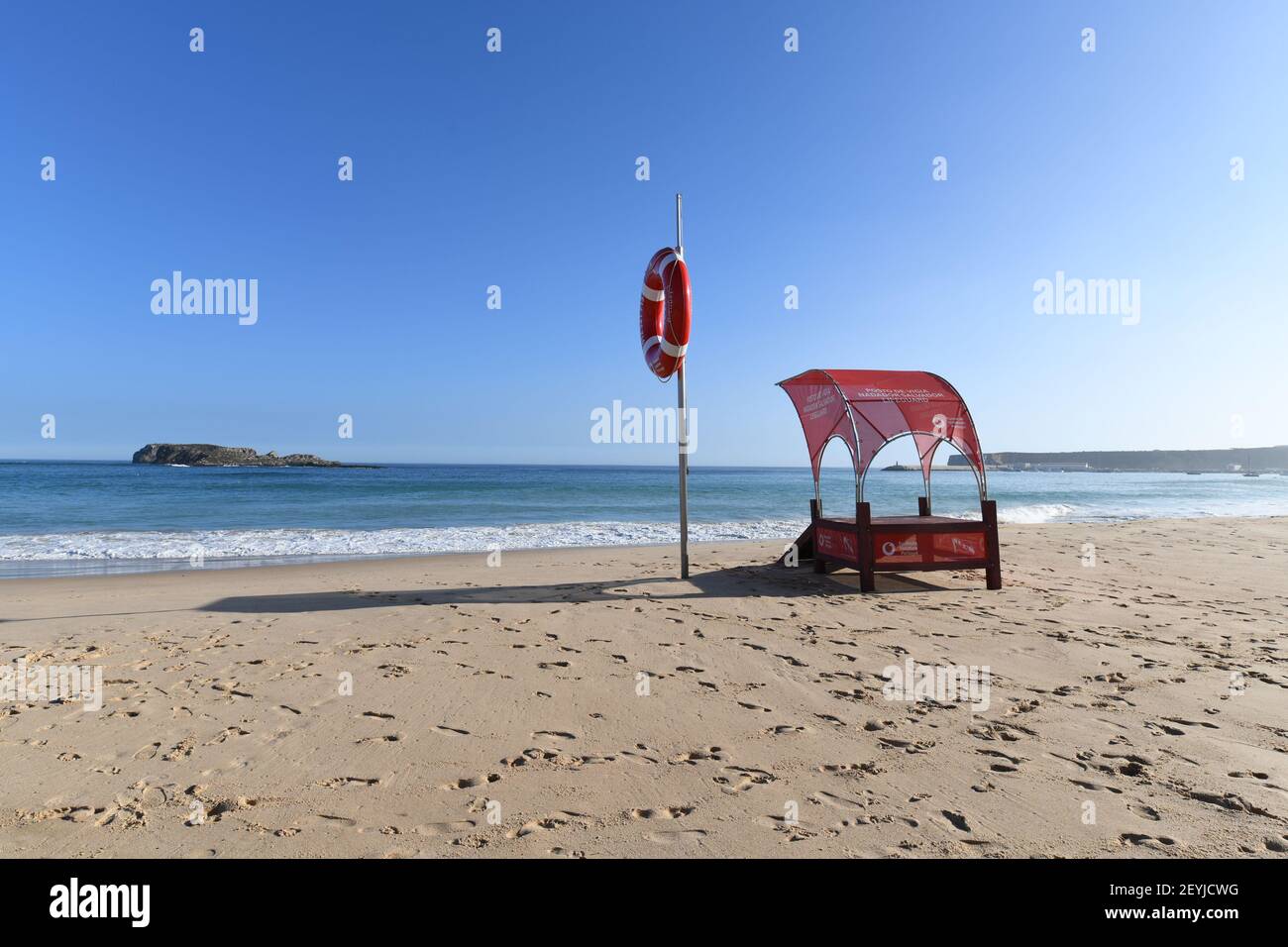 Sagres, Portugal: October 2020: Empty lifeguard post on an empty sandy beach Stock Photo