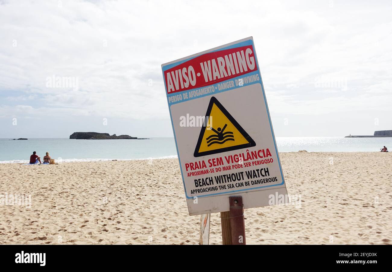 Sagres, Portugal: October 2020; Warning sign next to sandy beach in the Algarve saying there is no lifeguard on duty Stock Photo