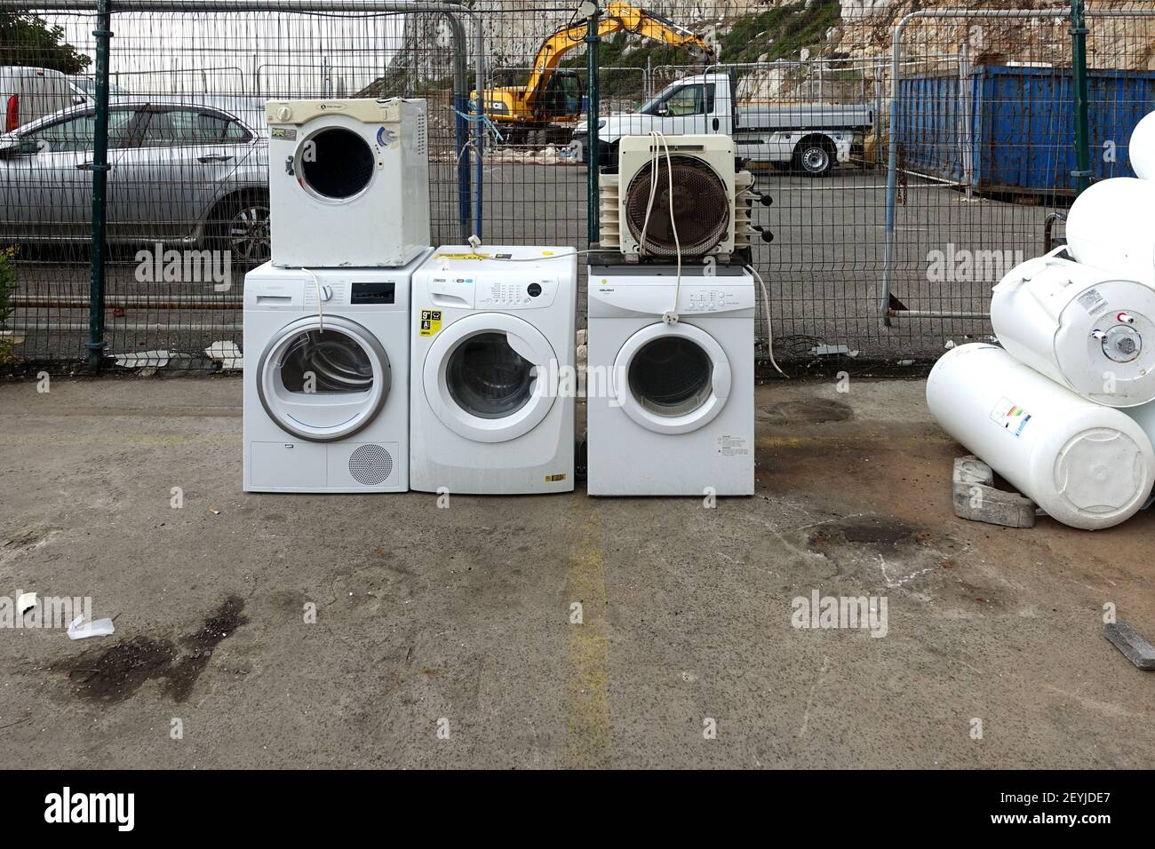 Gibraltar 09 November 2020: Lots of broken and old water heaters and washing machines at the local rubbish dump Stock Photo