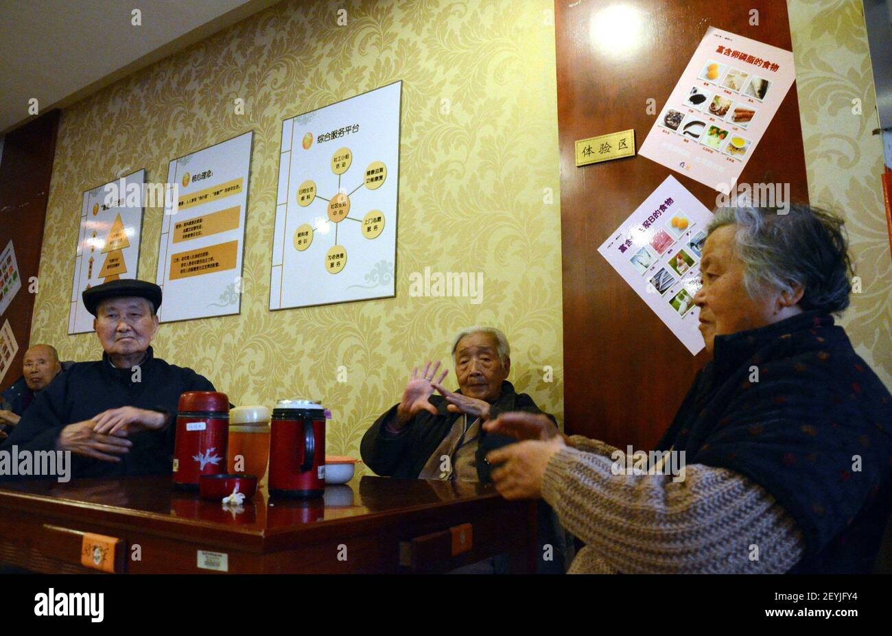 Senior citizens exercise their fingers at the Xintu Center for Health  Promotions in Shanghai, China on March 4, 2013. China's elderly are  increasingly turning to each other for companionship as their grown