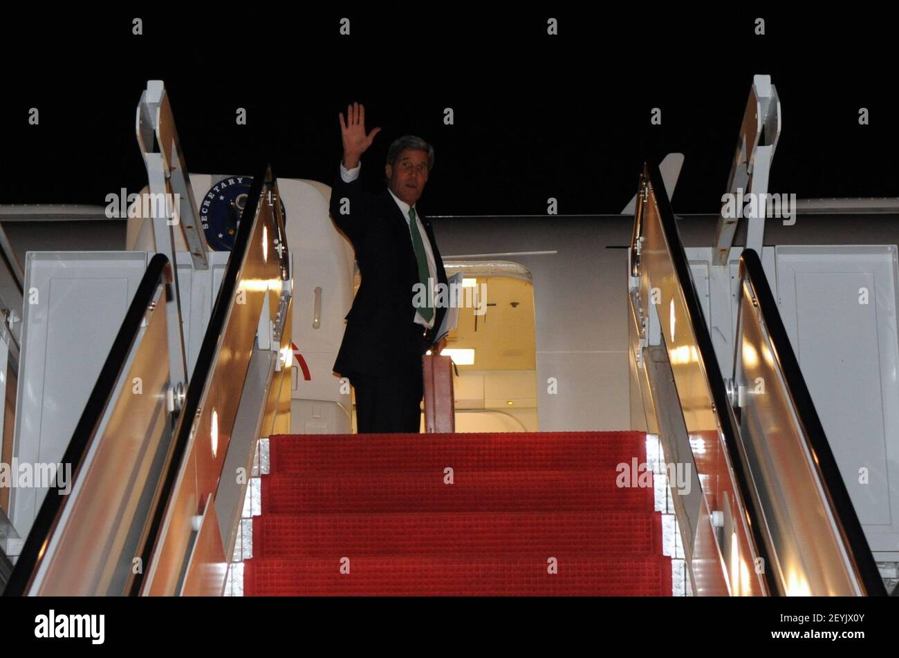 U.S. Secretary of State John Kerry waves goodbye at Andrews Air Force ...