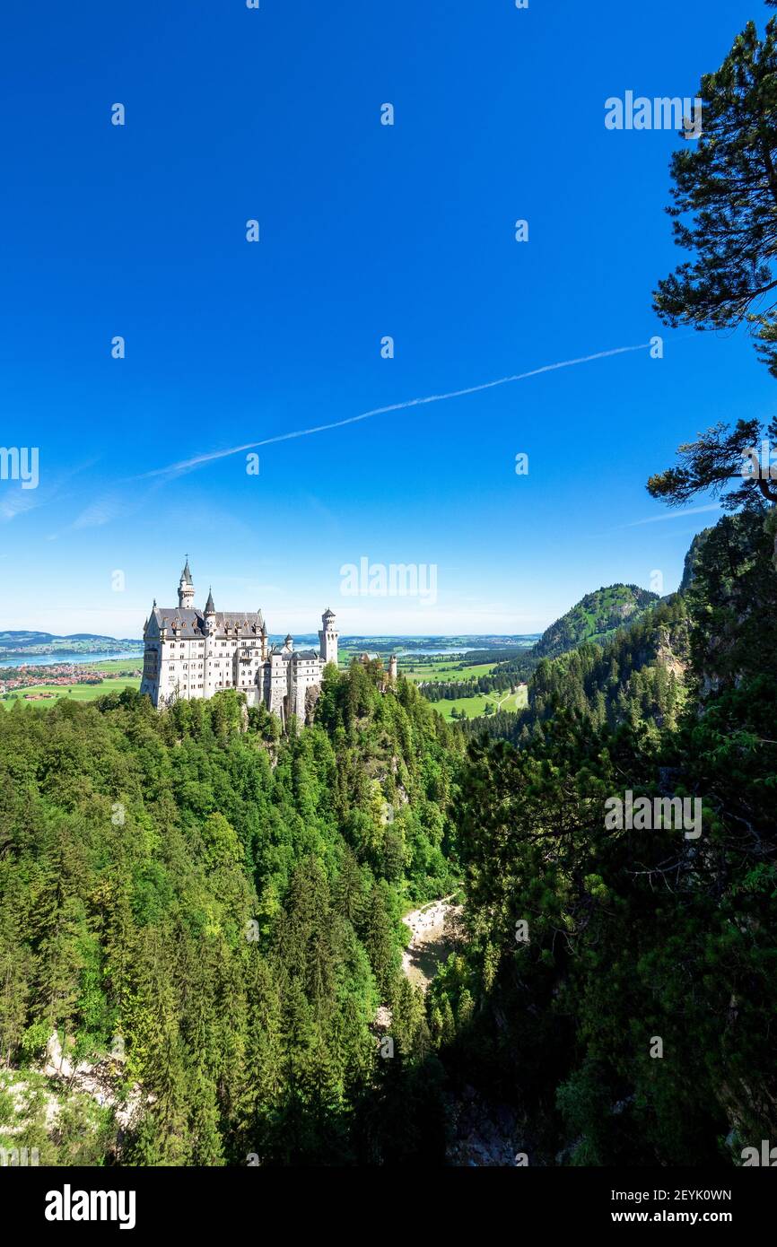 View of famous and amazing Neuschwanstein Castle, Bavaria, Germany, seen from the Marienbrücke (Mary's Bridge), a pedestrian bridge built over a cliff Stock Photo