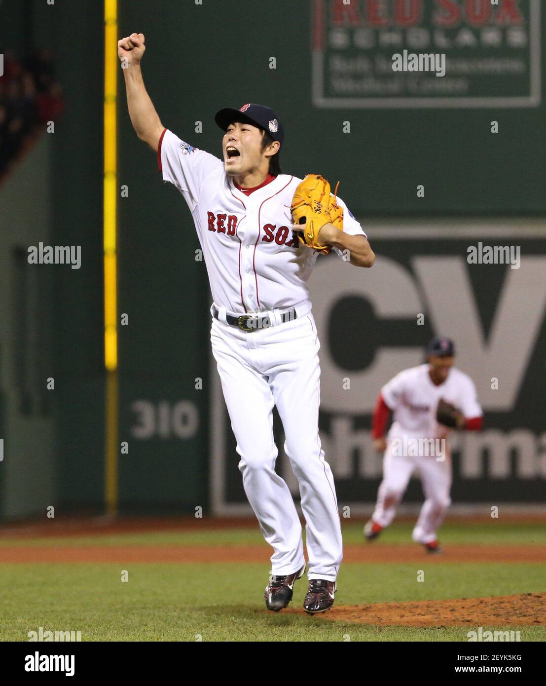 Boston Red Sox closer Koji Uehara reacts after striking out the St. Louis  Cardinals' Matt Carpenter to end Game 6 of the World Series at Fenway Park  in Boston, Massachusetts, on Wednesday