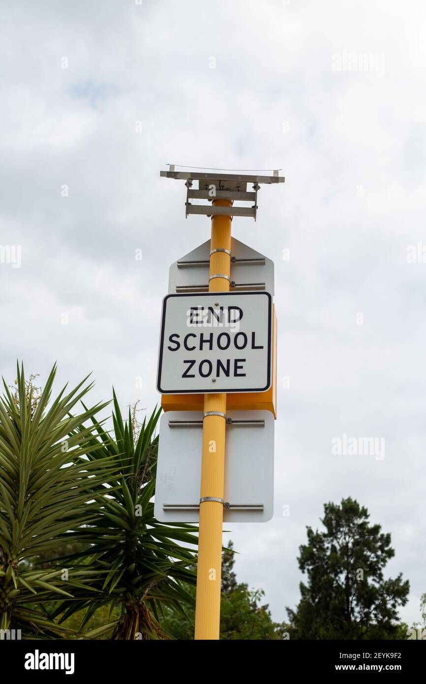 End school zone sign with sky background Stock Photo