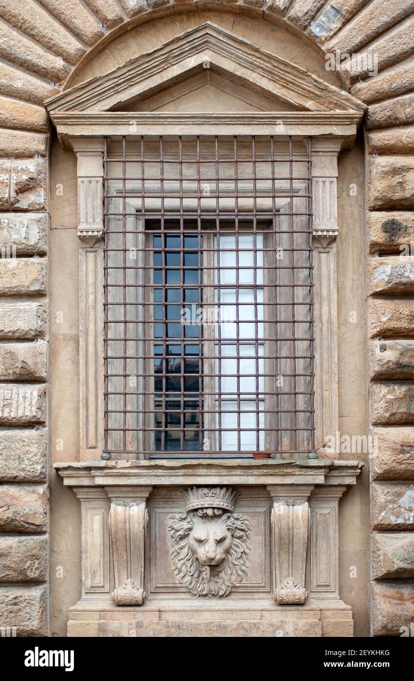 Florence, Italy - 2021, February 19: Lion's head stonework under a window, on the facade of Palazzo Pitti. Stock Photo