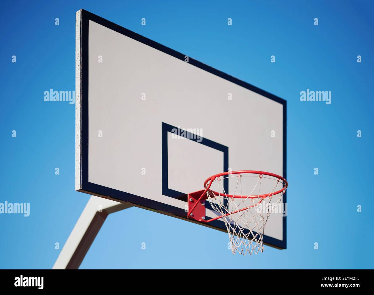 Basketball ring hoop side view on blue sky background Stock Photo