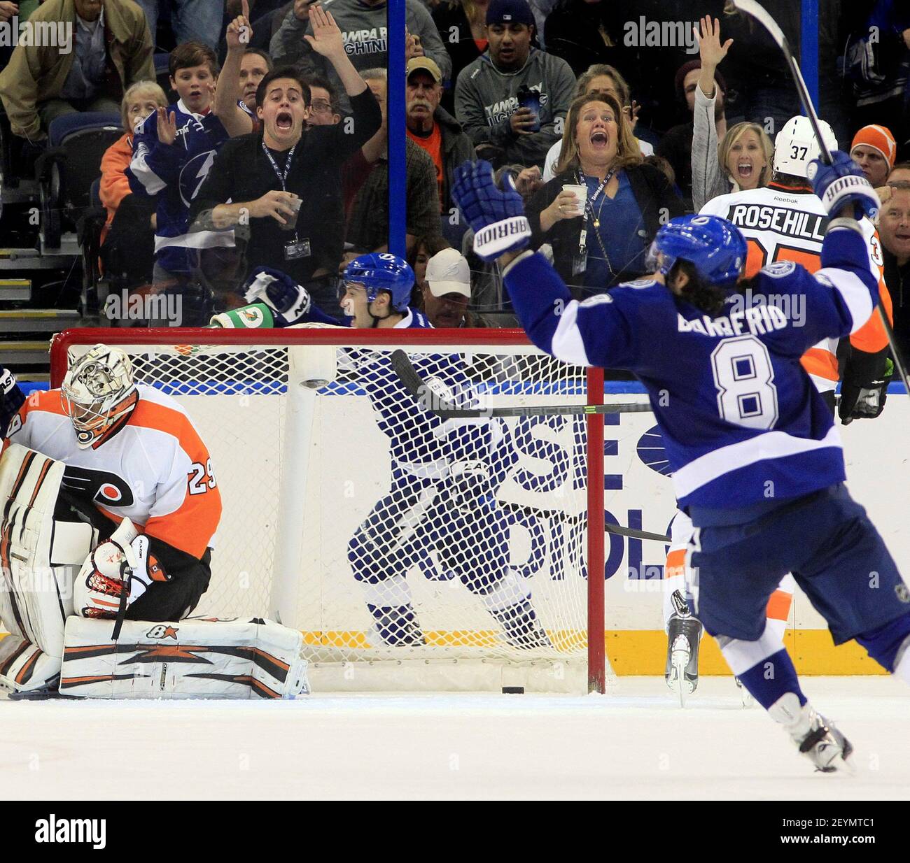 The Tampa Bay Lightning's Tyler Johnson, middle, and Mark Barberio (8