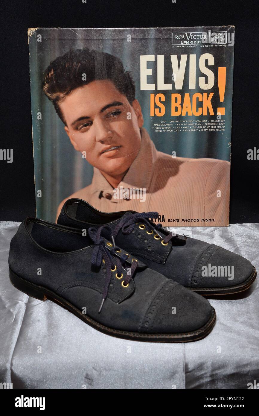 Elvis Presley's blue suede size 10 shoes from 1960 seen at a media preview  presented by Julien's Auction at the Hard Rock Cafe in New York, NY, on  December 3, 2013. (Photo