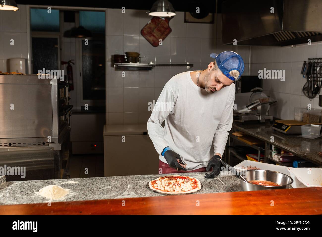 Chef prepares pepperoni pizza hi-res stock photography and images - Alamy
