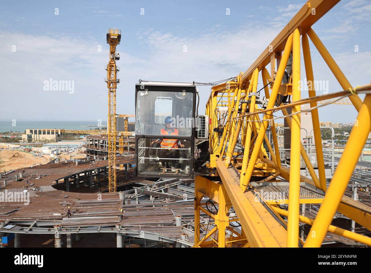 Haikou, China's Hainan Province. 5th Mar, 2021. Tower crane operator