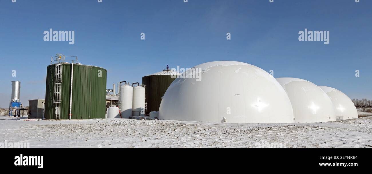 Large digester tanks hold the slurry for 30 days during the conversion ...