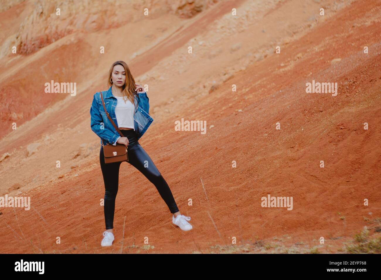 A fashionable female posing on the Sabrinsky Desert stones in Colombia Stock Photo
