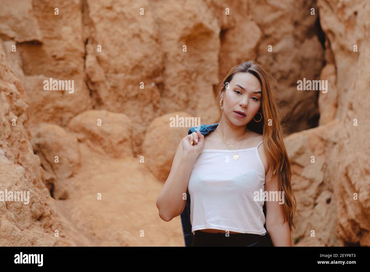 A young attractive female posing on the Sabrinsky desert in Colombia Stock Photo