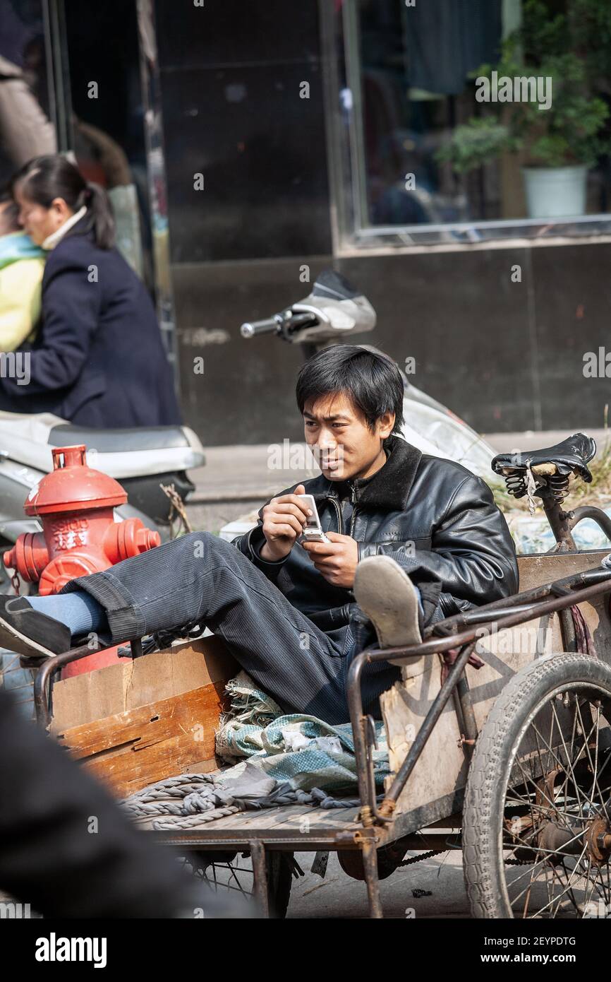 Man on bike with cart china hi-res stock photography and images - Alamy