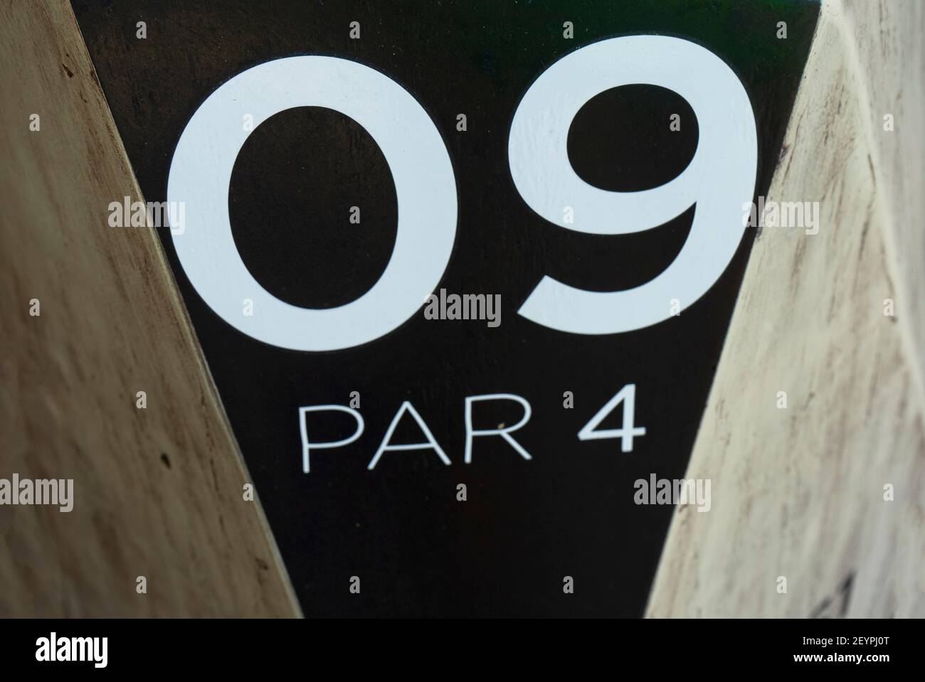 Indicative sign with text ' 09 Par 4', in a golf course. Golf hole sign. White letters and numbers. Playa del Carmen, Mexico Stock Photo
