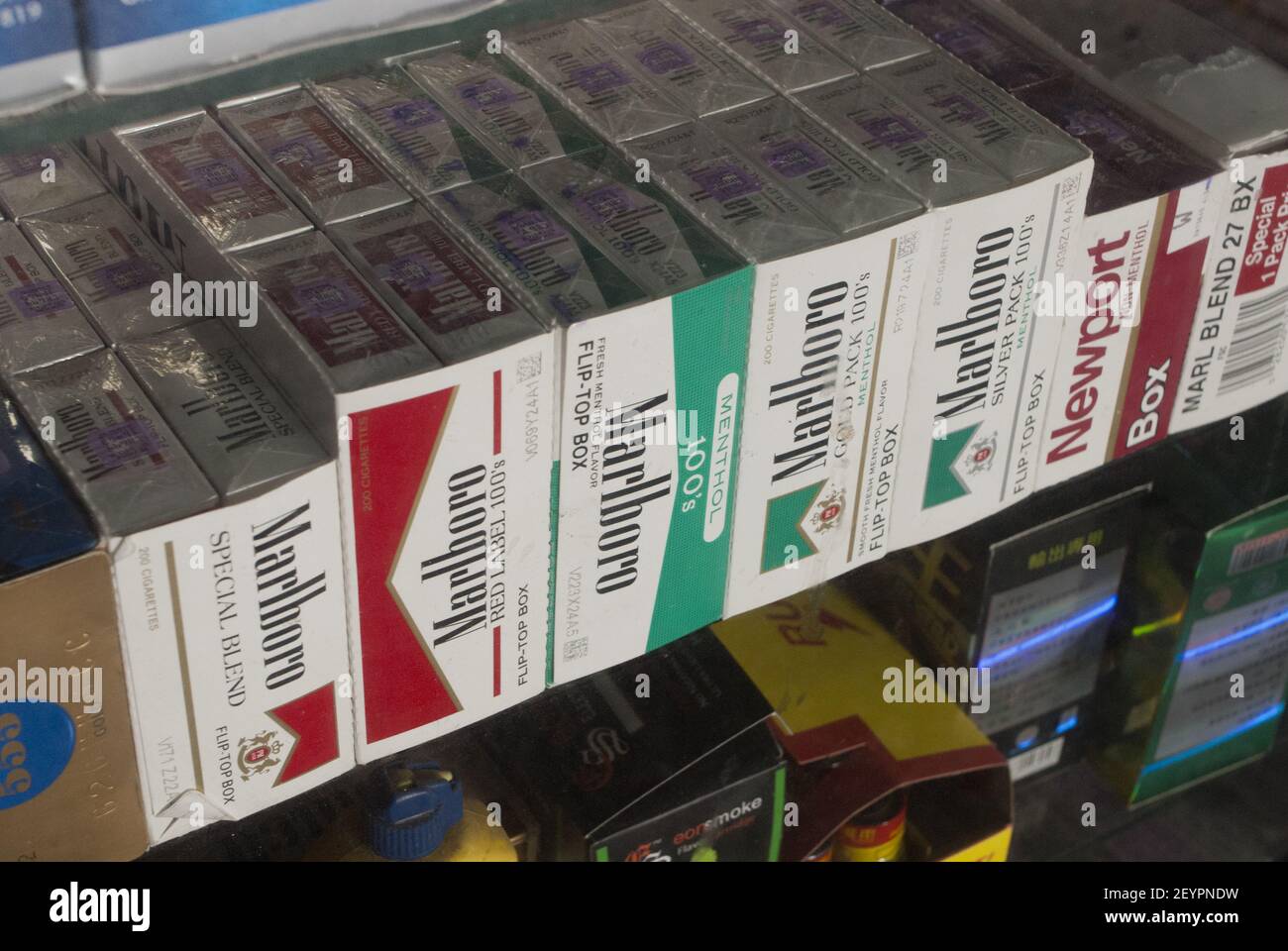Cartons of cigarettes in the window of a grocery store in New York on