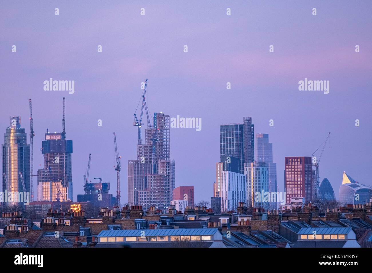 St George's Tower and surounding skyscrapers at dusk Stock Photo