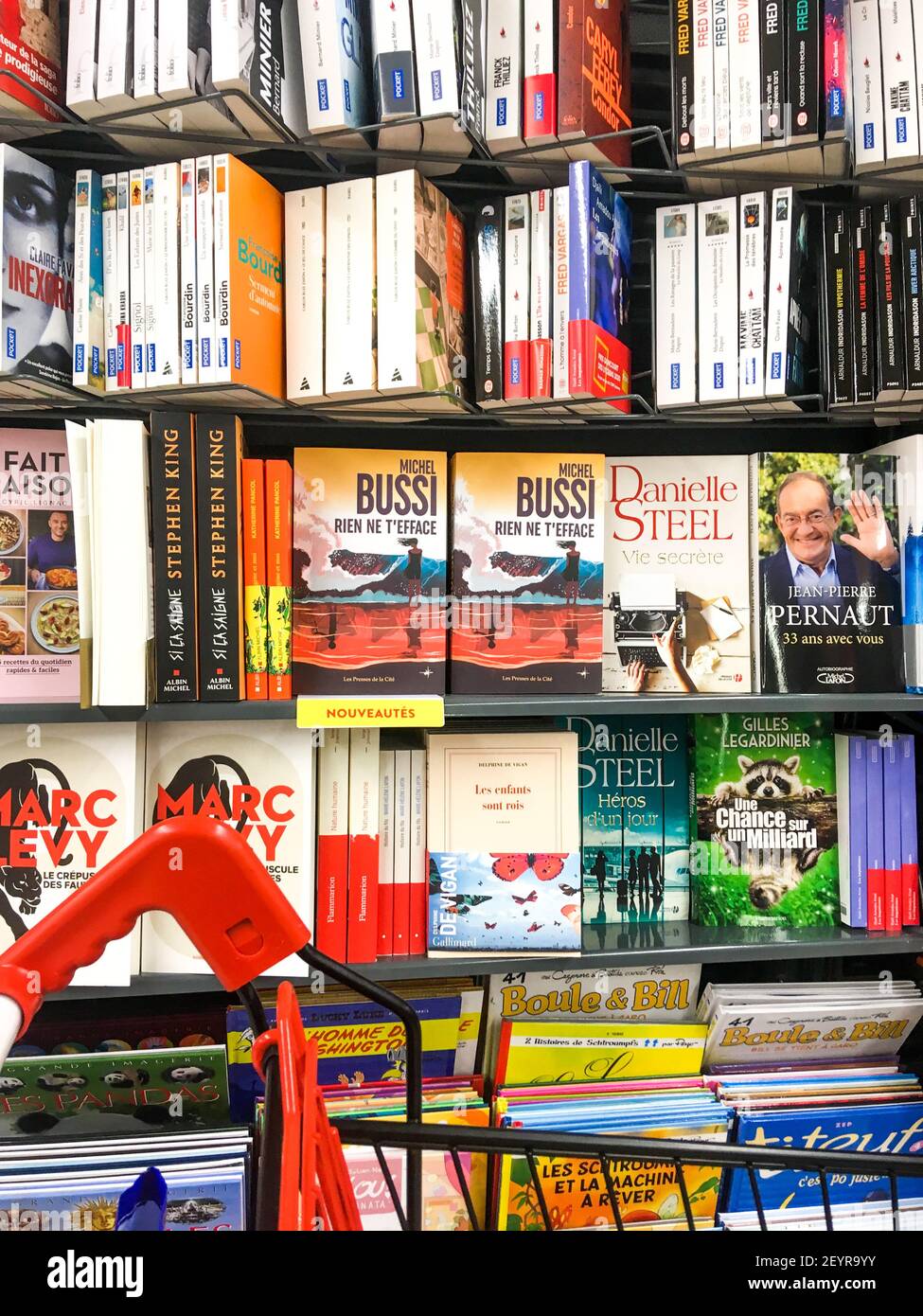Books displayed in the book section of a supermarket, Lyon, France Stock Photo