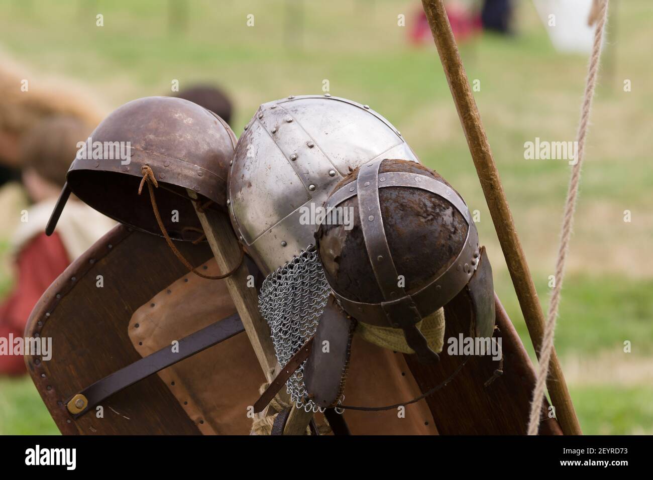 Early medieval spangenhelm or leather and steel skull cap with metal reinforcements in a re-enactment camp Stock Photo
