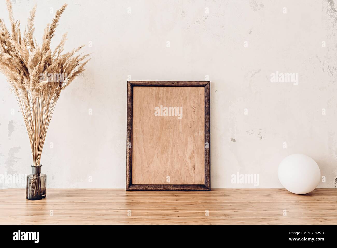 Wooden frame mockup on bamboo table for your artwork Stock Photo - Alamy