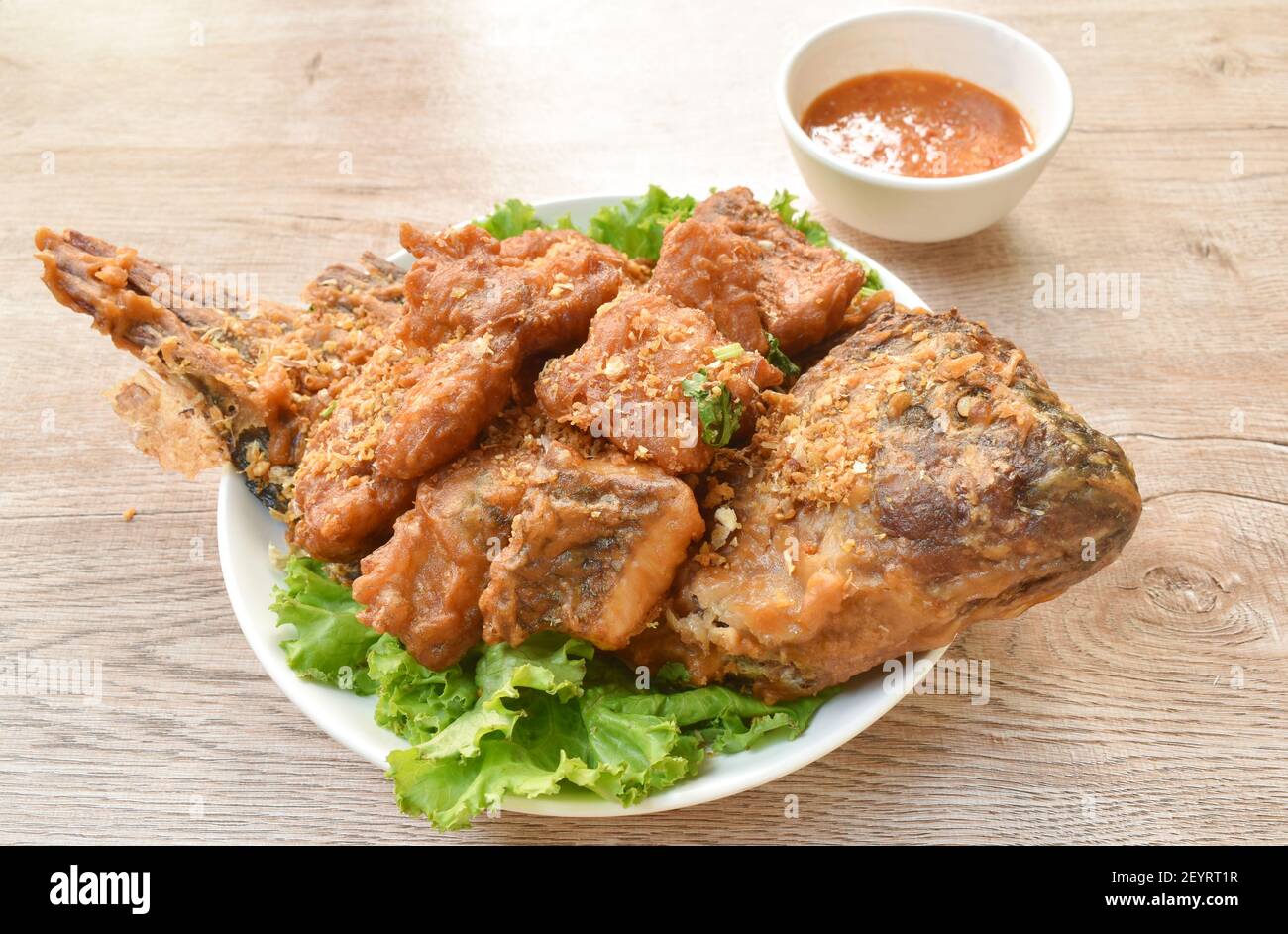batter fried slice mango or red Tilapia fish with chop garlic dipping