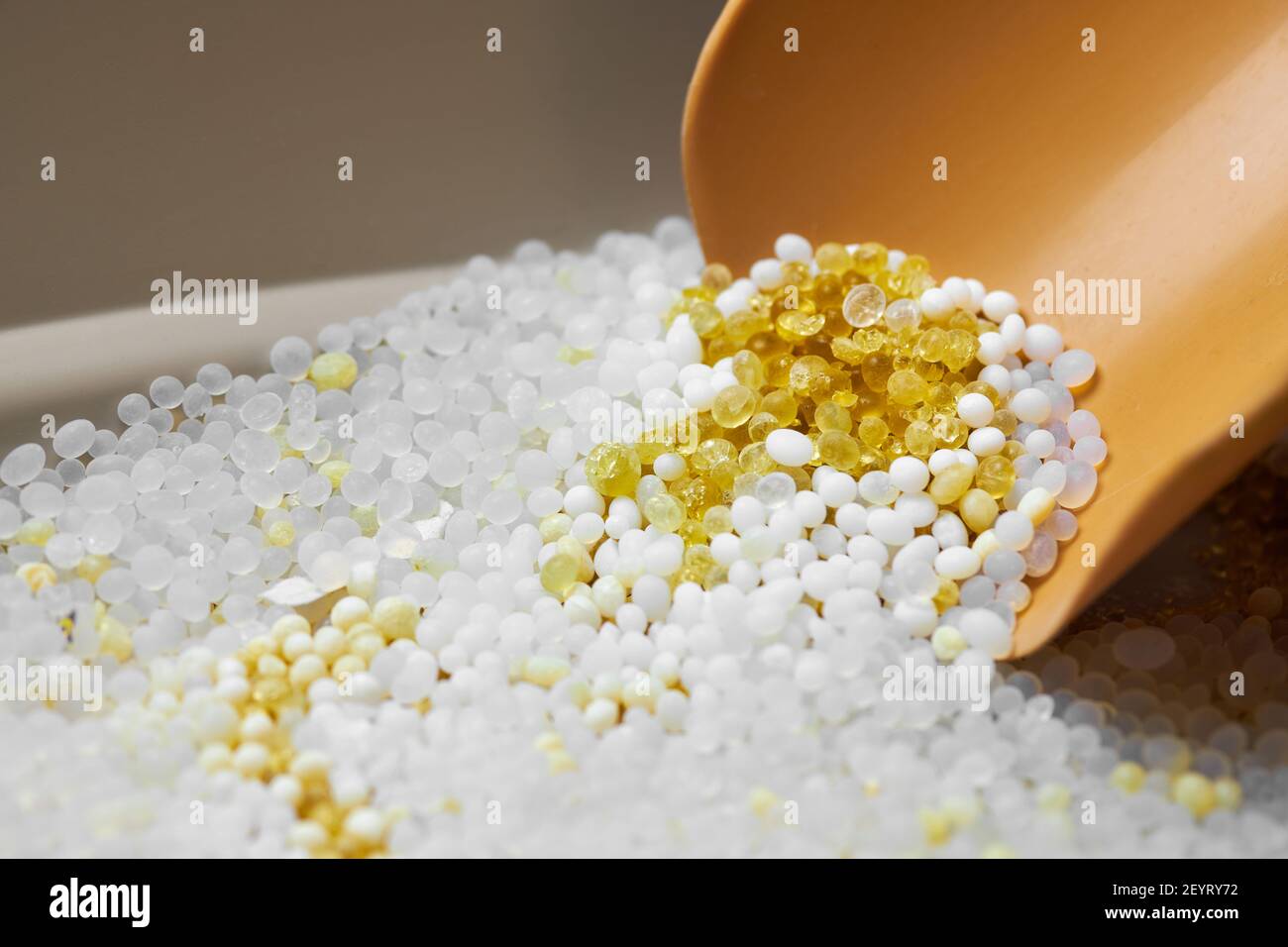 Silica gel in litter box. Dustpan in cat toilet with pee in silicagel