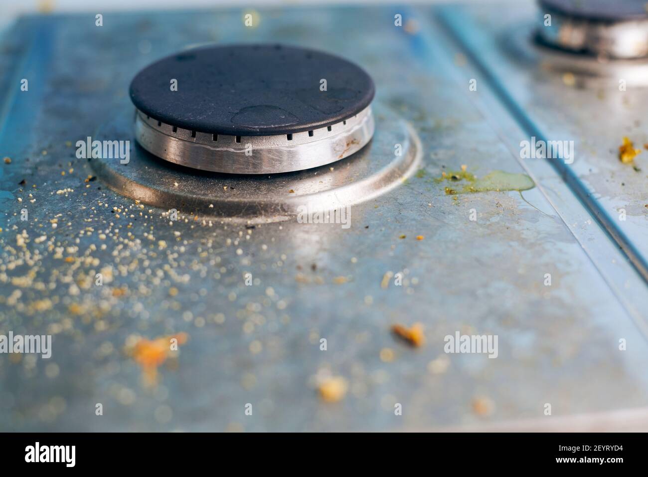 Dirty stove top with oil splatters, fat stains and food leftovers