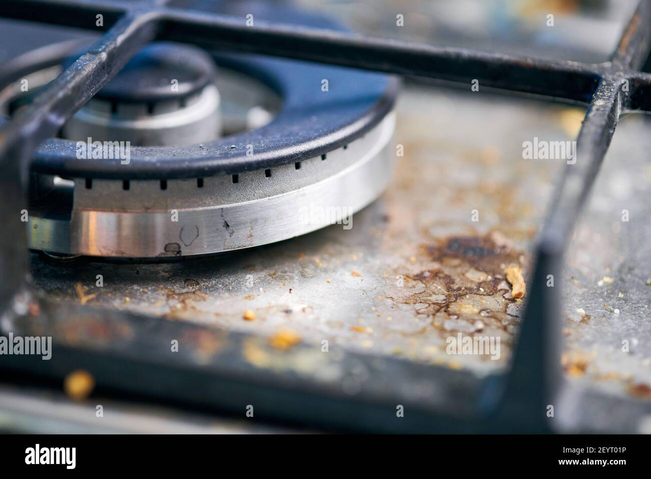 Dirty stove top with oil splatters, fat stains and food leftovers