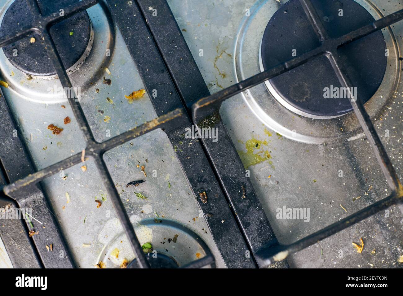 Dirty stove top with oil splatters, fat stains and food leftovers