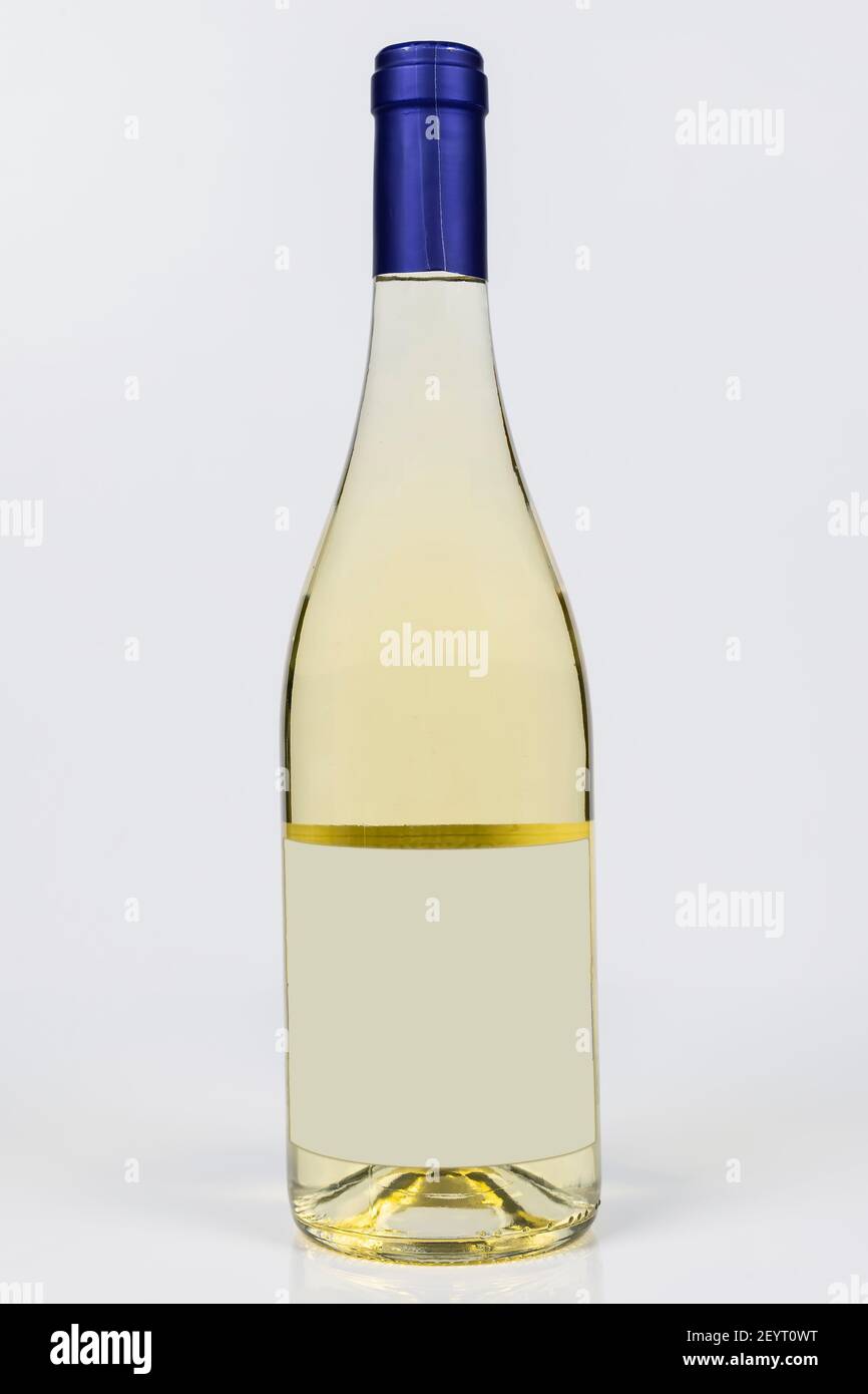 Beautiful burgundy bottle of white wine on white surface and background Stock Photo
